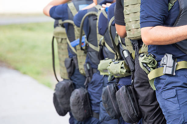law enforcement training team with tactical equipment and tactic stock photo
