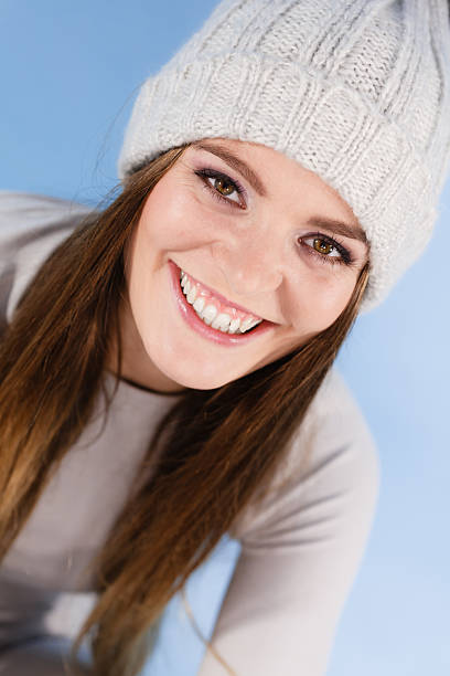 istock woman wearing winter wool cap portrait 627031402
