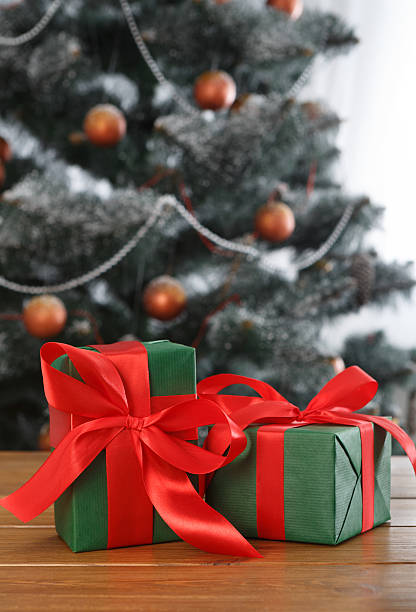 istock Christmas present on decorated tree background, holiday concept 627031470