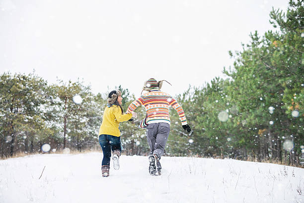 istock Loving couple in the winter park 627031736