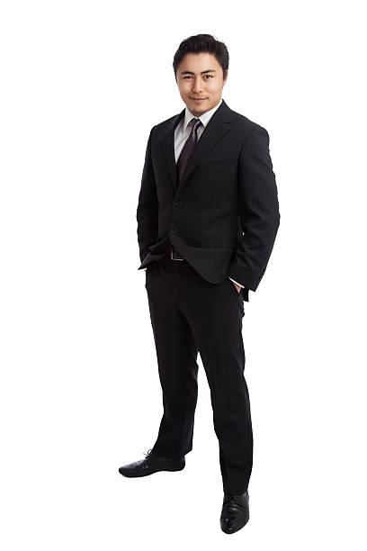 istock Handsome businessman with hand in pockets 627032064