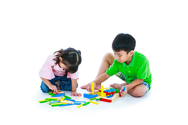 istock Children playing toy wood blocks, isolated on white background. 627032690