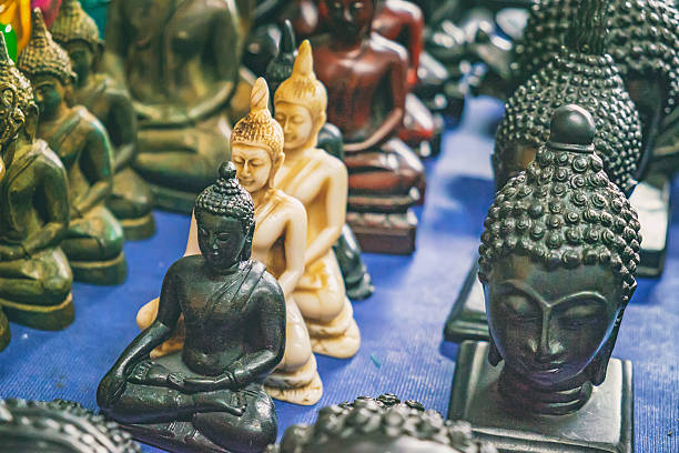istock Buddhist statuettes and souvenirs at night market 627032738