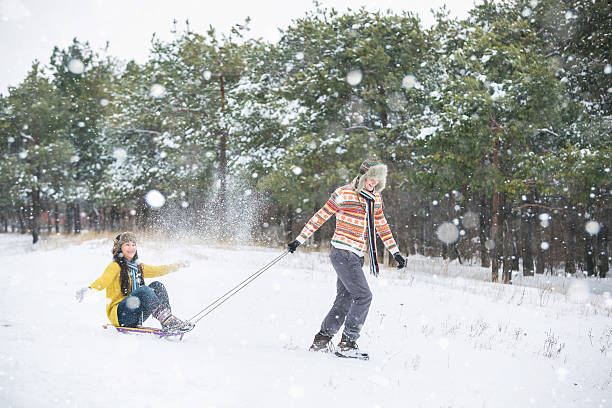 istock Loving couple in the winter park 627032754