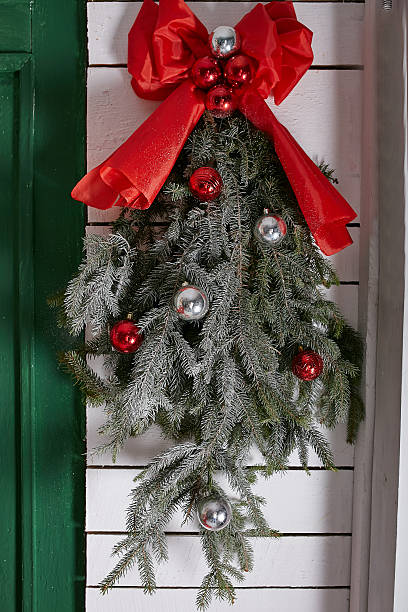 istock New Year wreath with a red bow and toys 627034522