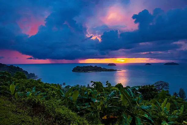 Photo of raining over blue sea at  sunset time koh chang