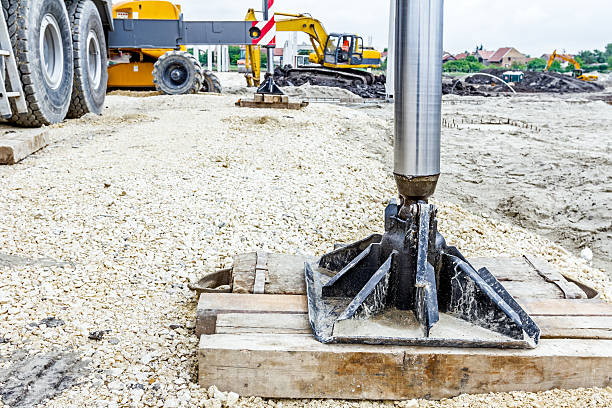 istock Hydraulic crane foot is supported by wood for safety, 627035732