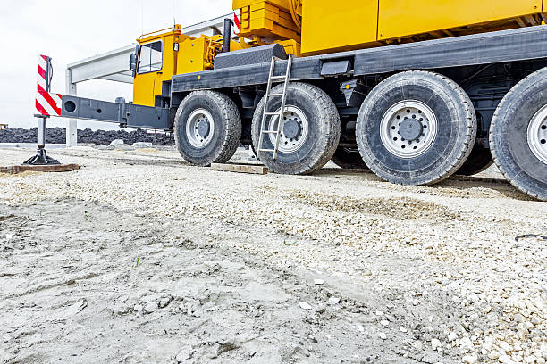 istock Low angle view on big crane's wheels, undercarriage 627036580