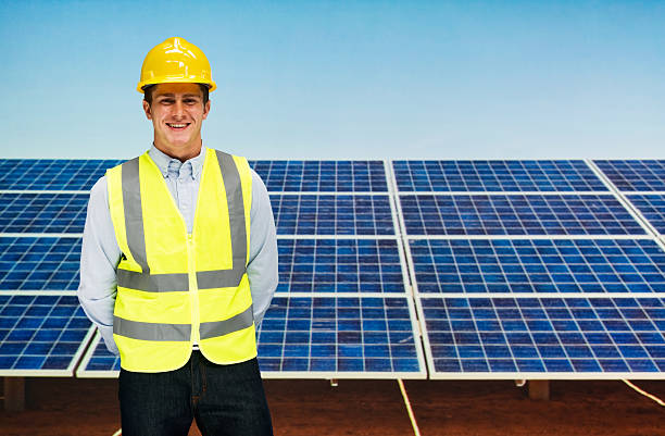 istock Smiling solar worker standing outdoors 627037082