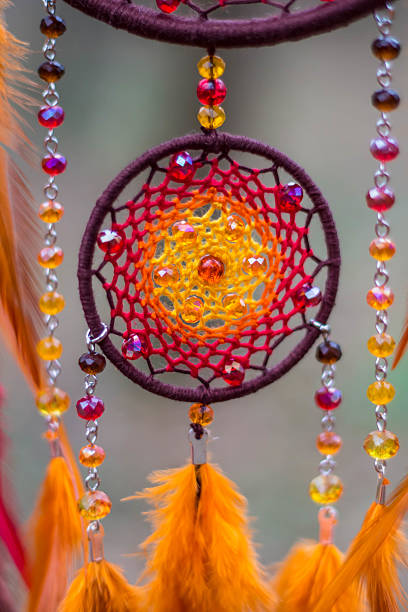 istock Dreamcatcher made of feathers, leather, beads, and ropes 627037922