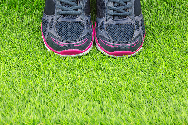 istock Sports shoes on grass 627038742