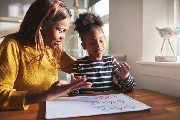 istock Happy young girl learning to calculate 627039378