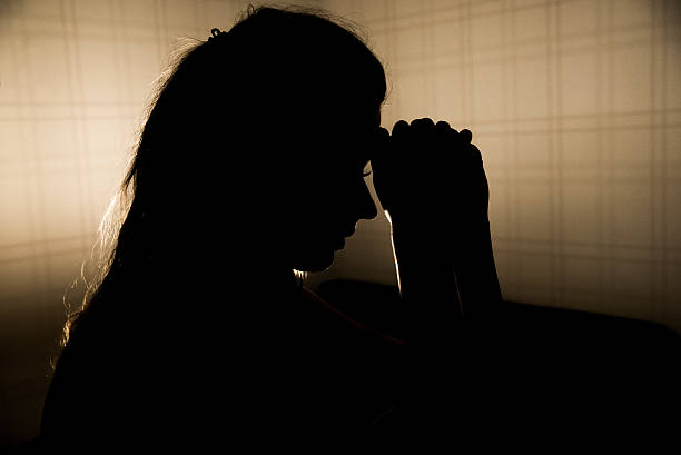 istock stressed young woman touching head and thinking 627040074
