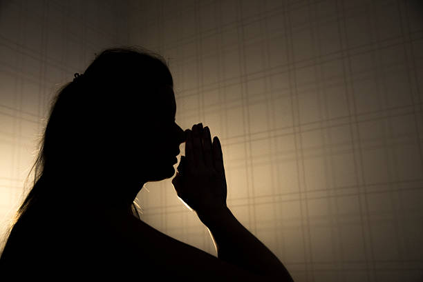 istock stressed young woman touching head and thinking 627040378