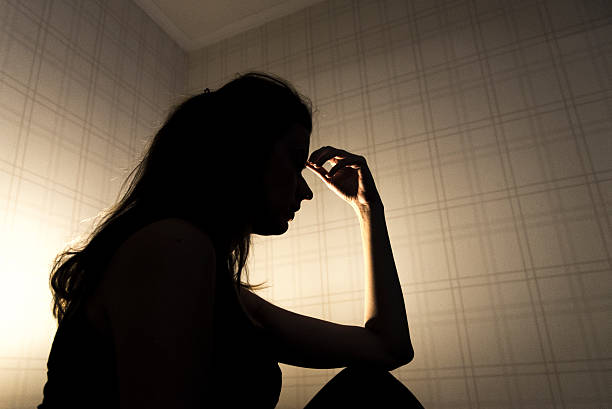 istock Sad woman touching head and thinking 627040534