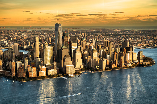 Helicopter point of view of Manhattan island in New York City at sunset.
