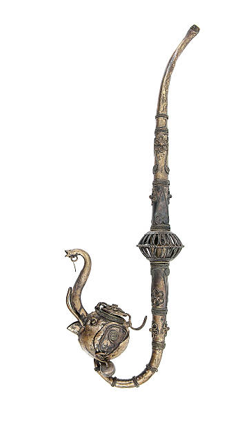 istock Antique brass tobacco pipe in elephant head shape isolated 627044098