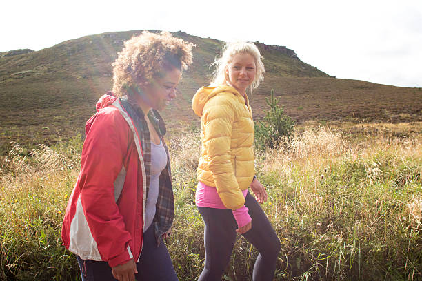 Friends hiking together at summer time.