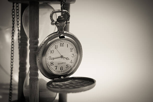 istock Old Clock and Hourglass Necklace 627045556