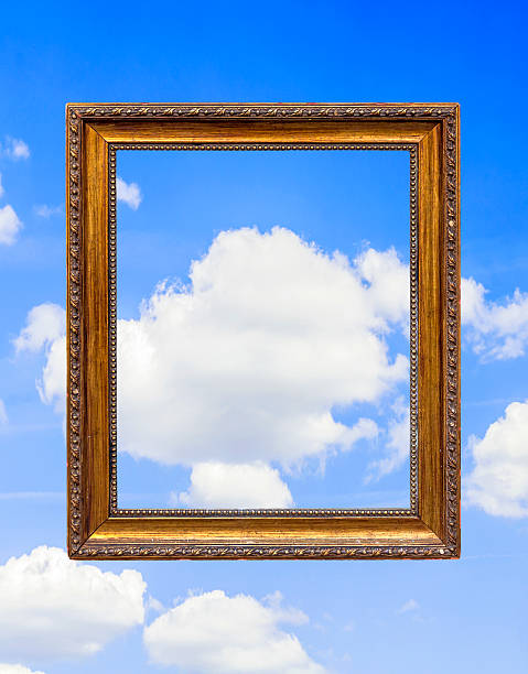 istock Vintage empty wooden frame aginst blue sky 627045670