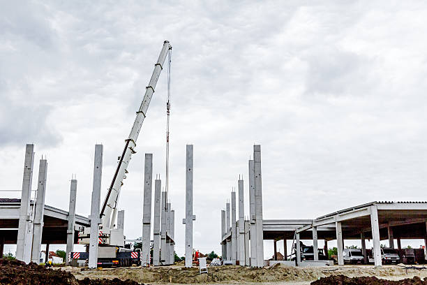 istock Mobile crane is assembly skeleton of huge hall 627046468