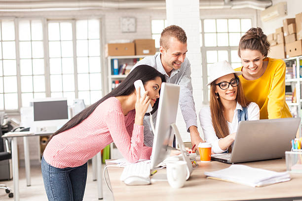 istock Group of friends working together in modern workplace 627048102