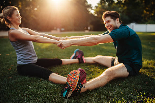 istock Young health couple doing stretching exercise 627048206