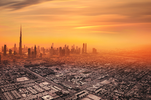 Aerial view of downtown Dubai in United Arab Emirates. Foggy sand storm day over the tall skyscrapers and office buildings on Sheikh Zayed Road.