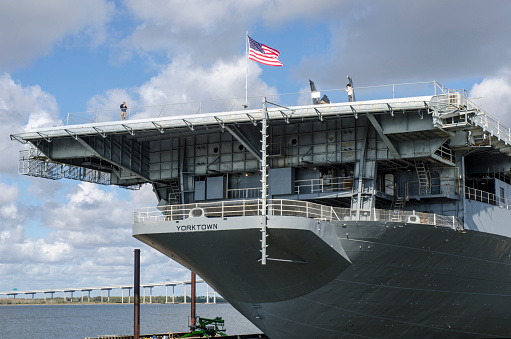 Mount Pleasant, South Carolina, USA - November 24, 2016: Decommissioned in 1970, the Aircraft Carrier USS Yorktown, is located at the Patriots Point Naval & Maritime Museum in Mount Pleasant, South Carolina, at the mouth of the Cooper River on the Charleston Harbor, across from Charleston. Patriots Point serves as an embarkation point for Fort Sumter tour boats and home to several other vessels (including the submarine USS Clamagore), the Cold War Submarine Memorial, a replica of a Vietnam Support Base, and the museum of the Medal of Honor Society.
