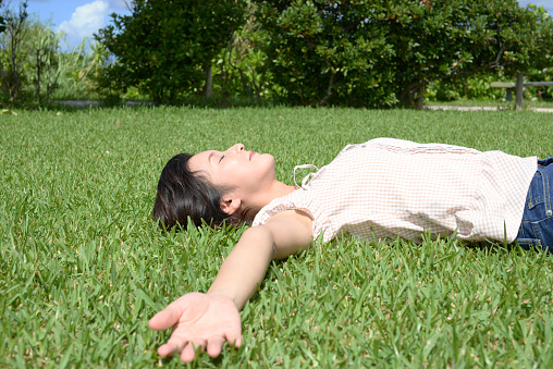 Woman lying on the grass