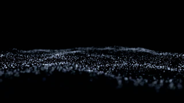 Particle sea waves isolated on black background. Network concept in 4K format.