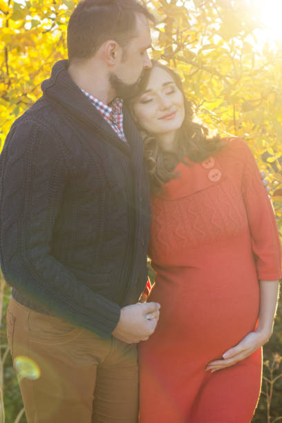 istock Young couple in sunset yellow lights 627067910