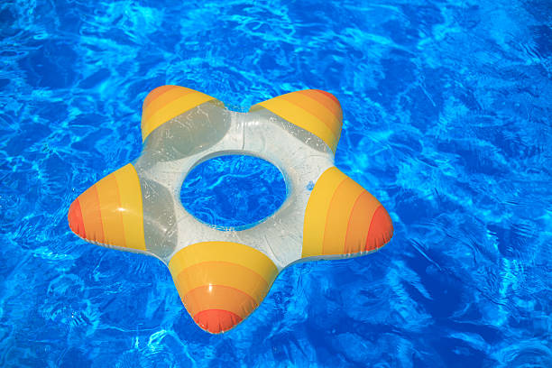 istock Lifebuoy on the water. Rubber star floating. 627068082