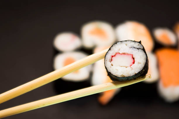 istock Pieces of sushi on a black stone 627069770
