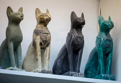 Luxor, Egypt - July 26, 2016: A row of carved alabaster cats available as souvenirs in Luxor.
