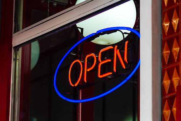 istock Neon sign of a store with the word Open 627071102
