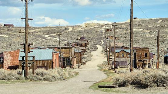 Bodie is a ghost town in the Bodie Hills east of the Sierra Nevada, it became a boom town in 1876 (146 years ago) after the discovery of a profitable line of gold; by 1879 it had a population of 7,000–10,000.