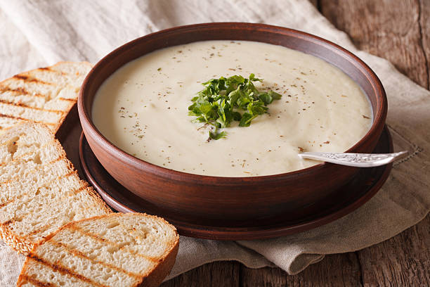 white vegetable cream soup close-up on the table. horizontal - cauliflower vegetable portion cabbage imagens e fotografias de stock