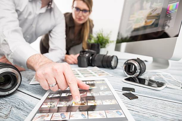 Photographers computer with photo edit programs. photographer journalist camera photo dslr editing edit designer photography teamwork team memories lighting shooting commercial contemporary shoot objects objective concept - stock image photo editor photos stock pictures, royalty-free photos & images