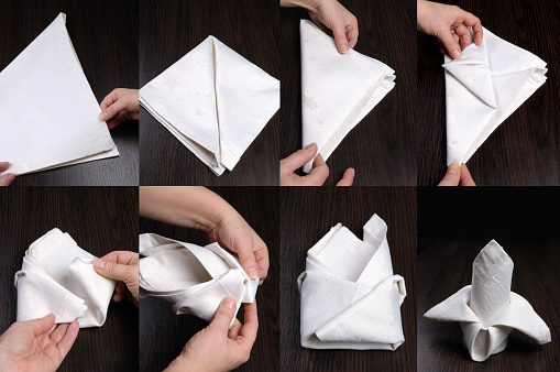 Instructions on how to fold a napkin in stages