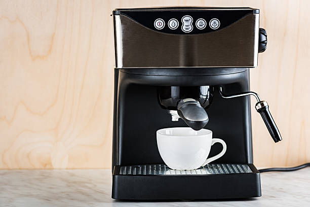 istock prepare a cup of coffee in espresso machine 627089548