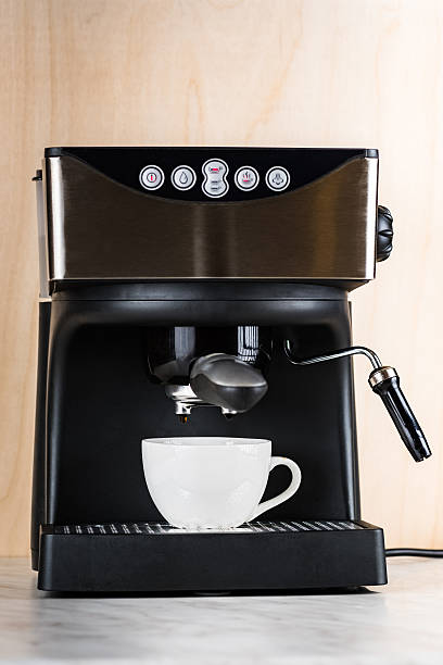 istock prepare a cup of coffee in espresso machine 627089636