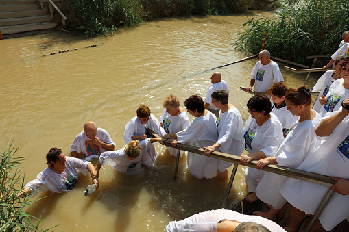 Jericho, Israel - November 1, 2016: Group of Pilgrims at the Baptism Site called Qasr el Yahud. Its located at Jordan River in the Region of the West Bank in Israel