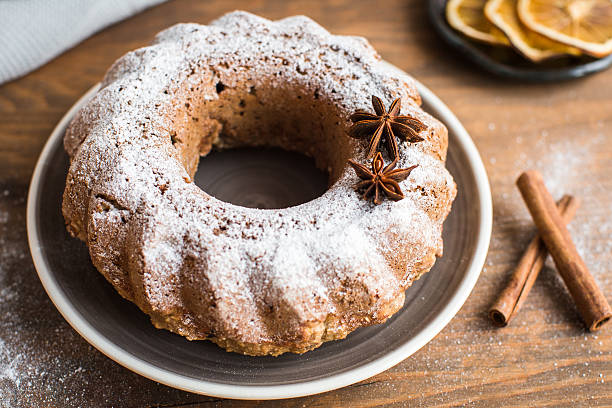 istock Christmas cake with raisins and cinnamon on the table 627092254