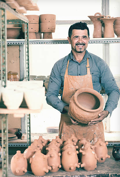 istock Male artisan in ceramics workshop 627092948