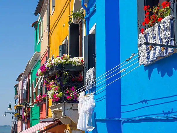 Row of multi coloured windows in Burano