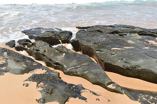 istock stones and turquoise sea water 627101562