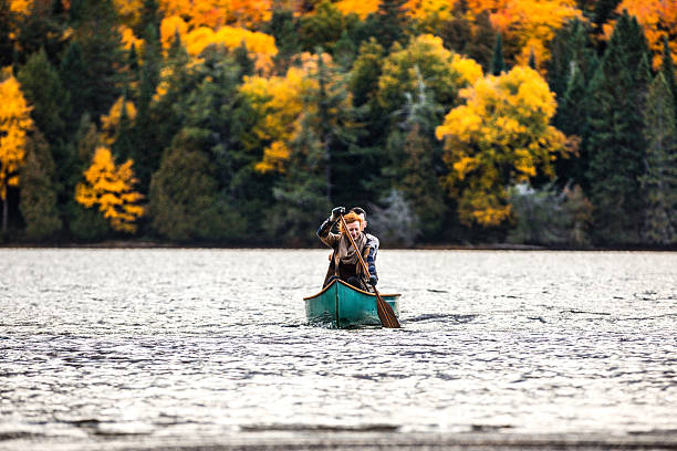 istock Couple enjoying a ride on a typical canoe in Canada 627102458