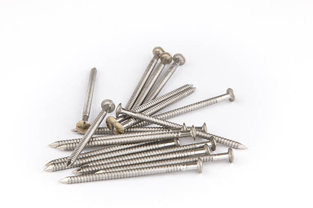 istock Bunch of inox nails close up on a white background 627103444