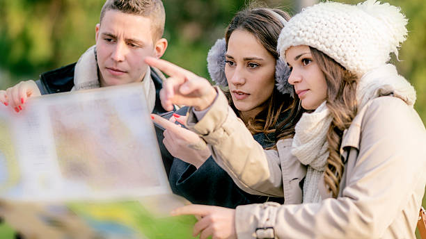 istock Friends with map outdoors 627104536